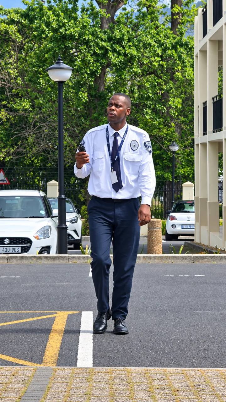Empire officer with a radio patrolling a parking area