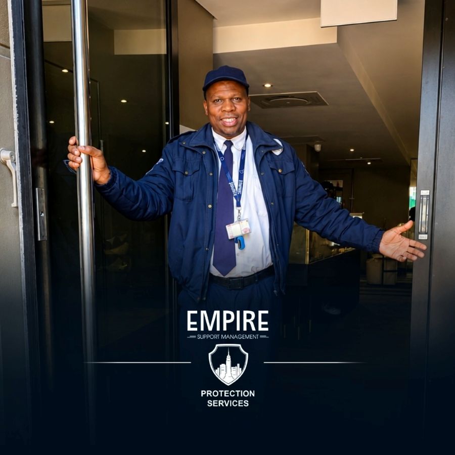Smiling Empire officer holding open the entrance door of a building