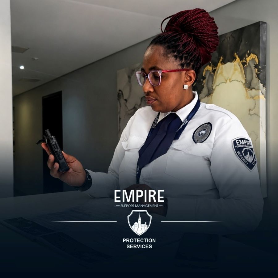 Empire officer at a lobby desk checking her radio